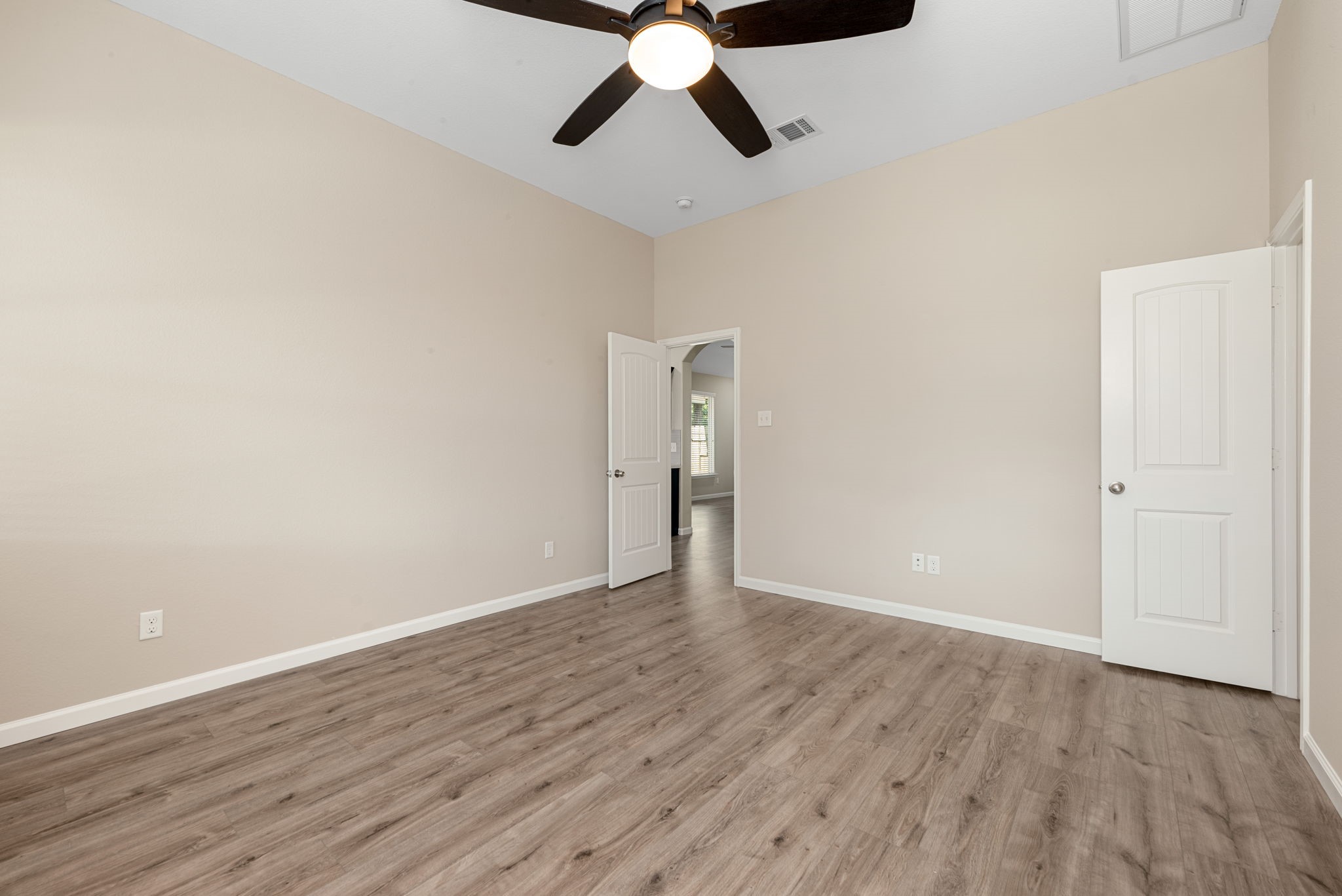 11429 West Woodmark Conroe, TX 77304 - Photo 17 of 29 wooden floor in an empty room