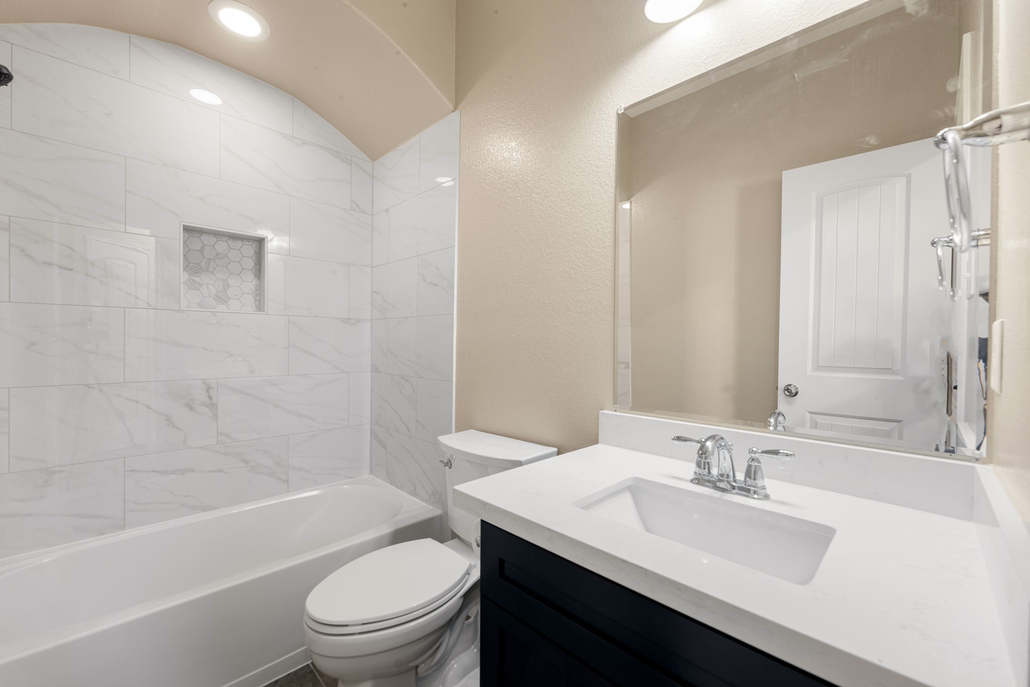 11429 West Woodmark Conroe, TX 77304 - Photo 25 of 29 a bathroom with a sink a toilet and shower