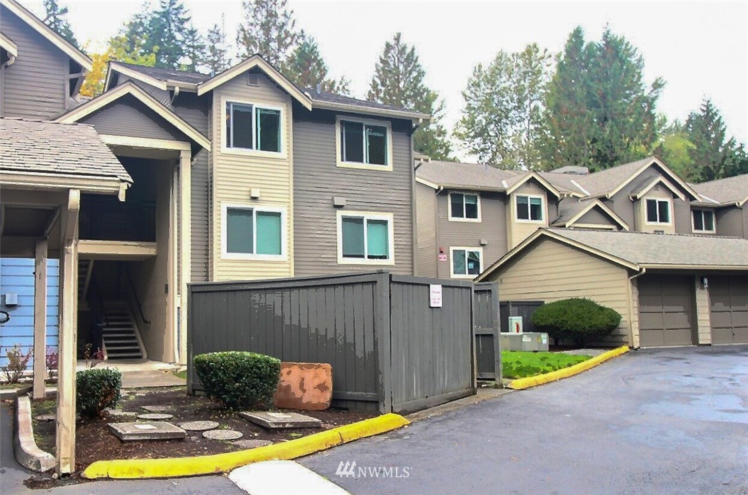 19404 Bothell Way Northeast, Unit B304 Bothell, WA 98011 - Photo 1 of 38 a view of a house with a swimming pool and a yard