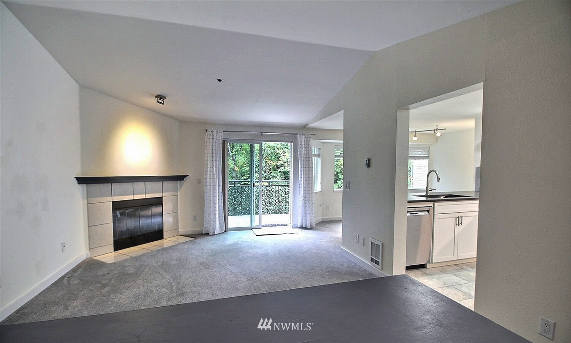 19404 Bothell Way Northeast, Unit B304 Bothell, WA 98011 - Photo 2 of 38 a open kitchen with a sink and a fireplace