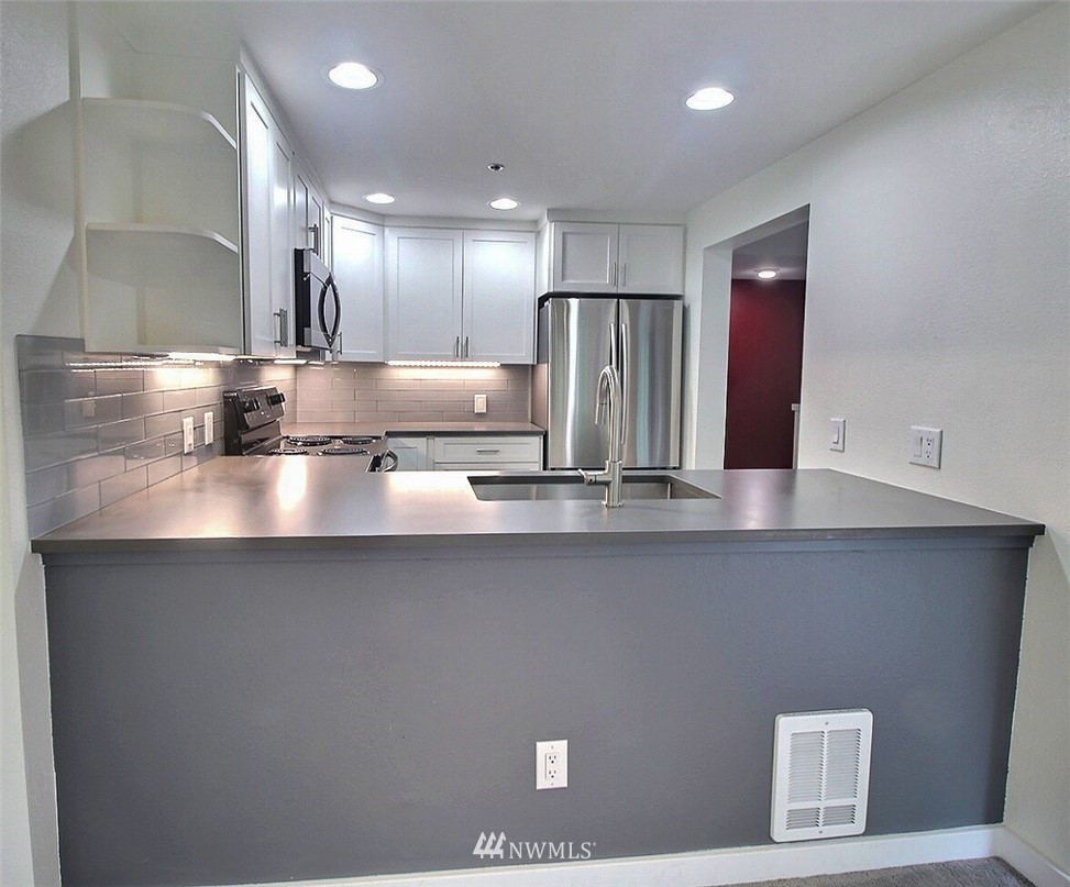 19404 Bothell Way Northeast, Unit B304 Bothell, WA 98011 - Photo 12 of 38 a kitchen with a sink and refrigerator
