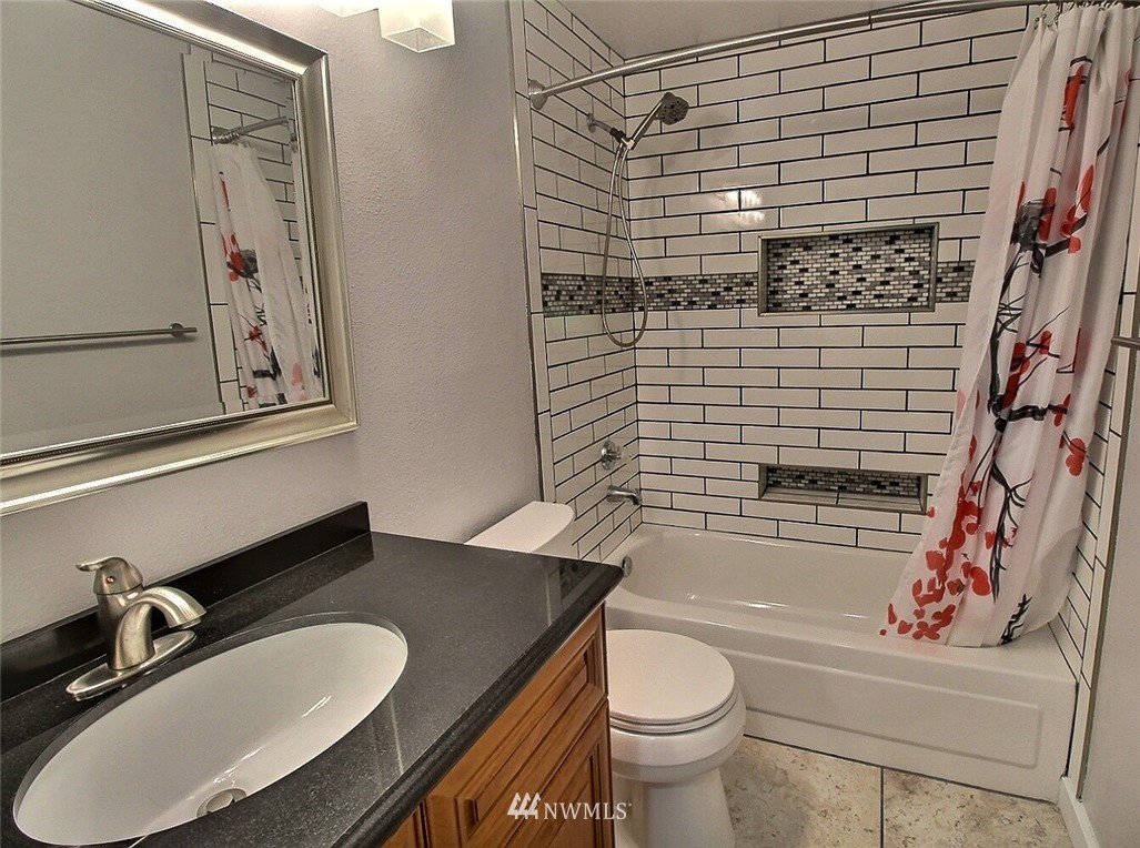 19404 Bothell Way Northeast, Unit B304 Bothell, WA 98011 - Photo 20 of 38 a bathroom with a sink toilet and shower