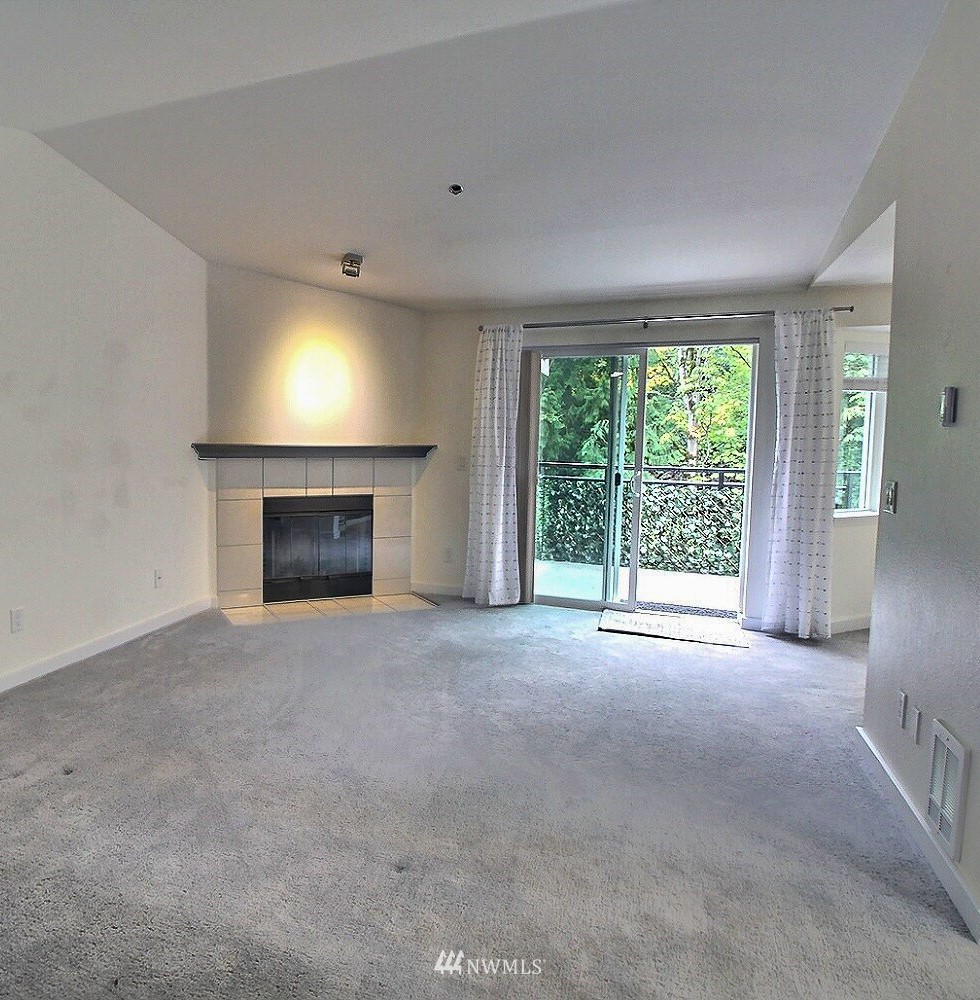 19404 Bothell Way Northeast, Unit B304 Bothell, WA 98011 - Photo 3 of 38 a view of empty room with a fireplace