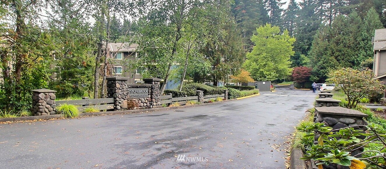 19404 Bothell Way Northeast, Unit B304 Bothell, WA 98011 - Photo 28 of 38 a view of a patio with a table and chairs and potted plants
