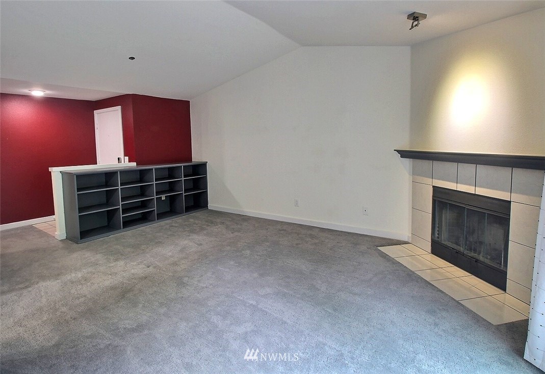 19404 Bothell Way Northeast, Unit B304 Bothell, WA 98011 - Photo 5 of 38 a room with furniture and a fireplace