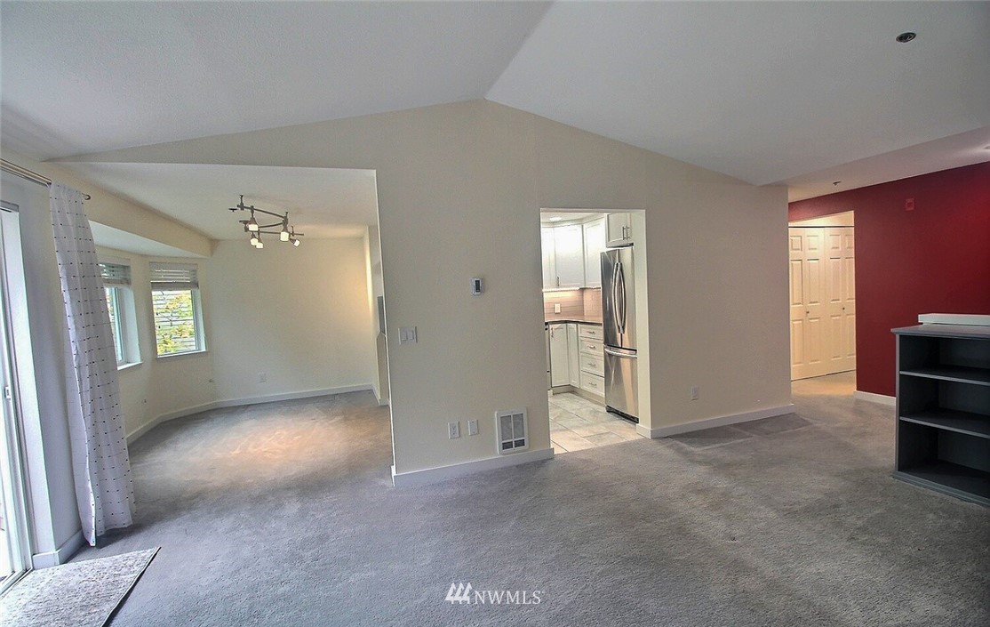 19404 Bothell Way Northeast, Unit B304 Bothell, WA 98011 - Photo 8 of 38 an empty room with windows and cabinet