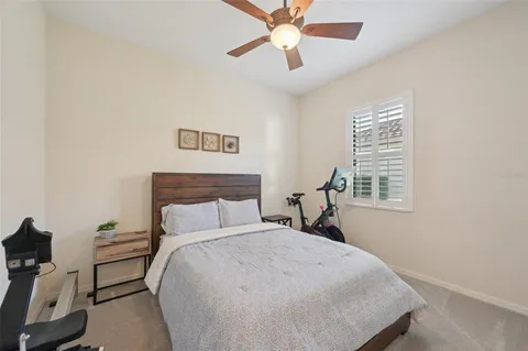 a bathroom with a toilet a sink a mirror and vanity