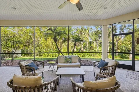 a dining room with furniture a chandelier and a rug