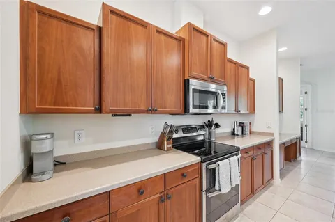 a kitchen with stainless steel appliances a sink dishwasher stove and cabinets
