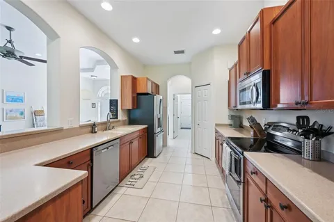 a living room with furniture a rug and a large window