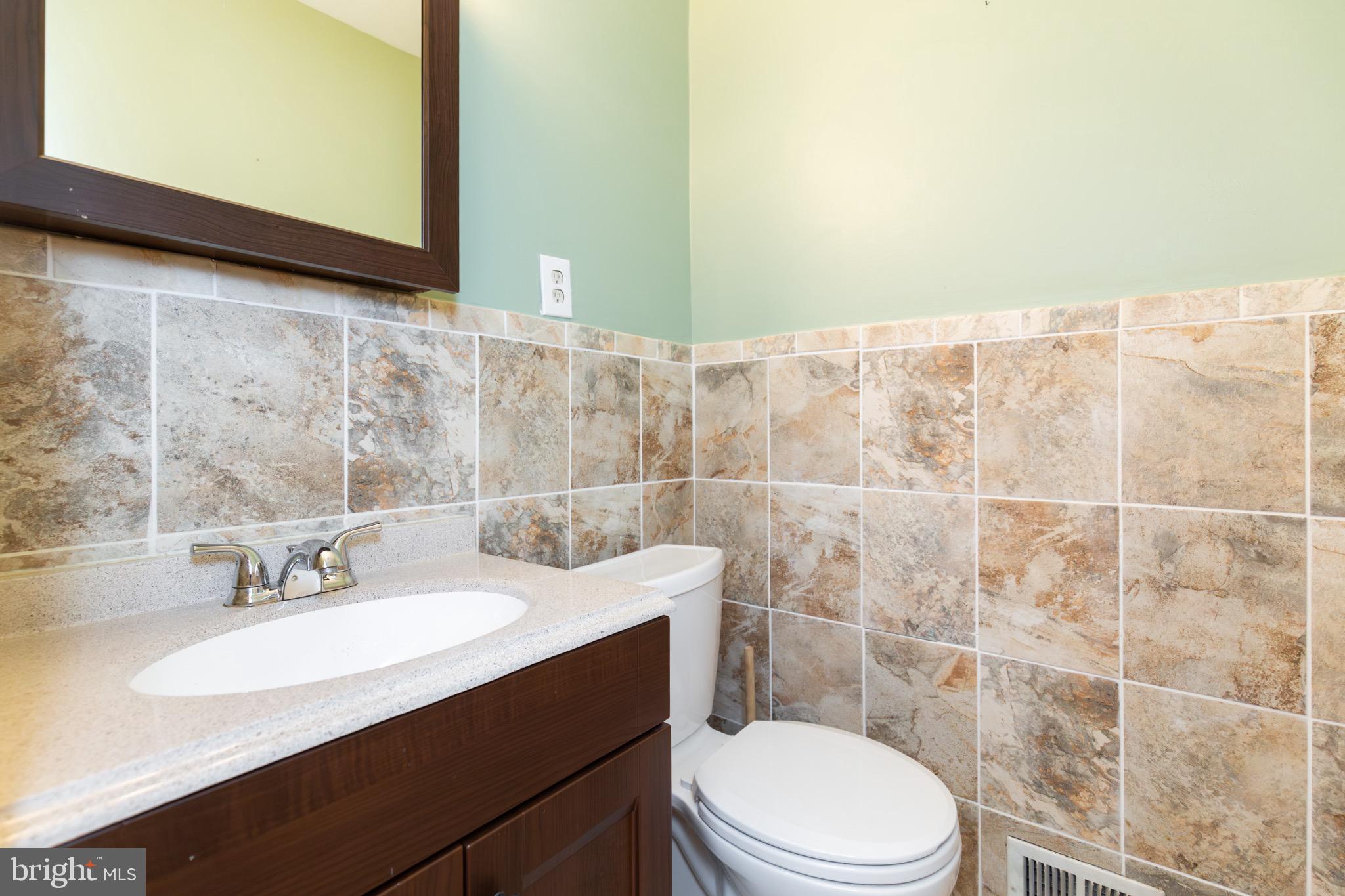32 Bristol Court Stafford, VA 22556 - Photo 4 of 25 a bathroom with a sink a toilet and shower