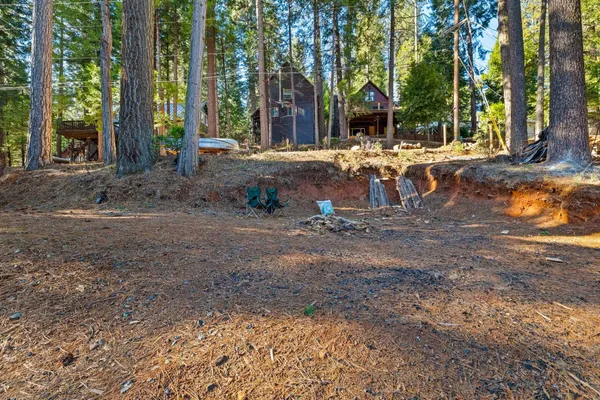 a view of outdoor space with playground and green space