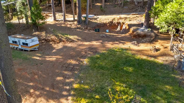 a view of a yard with an outdoor space