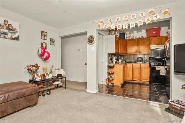 a kitchen with stainless steel appliances granite countertop a refrigerator and a stove