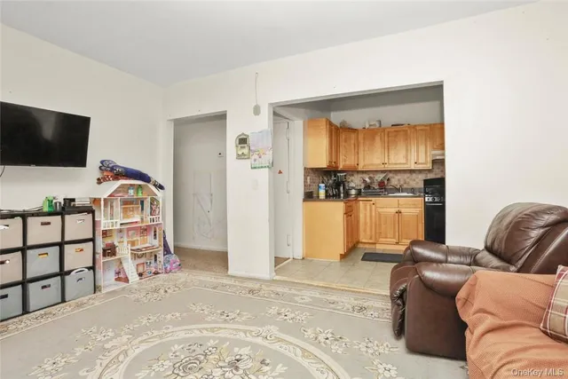 a kitchen with granite countertop stainless steel appliances a stove a sink and a refrigerator