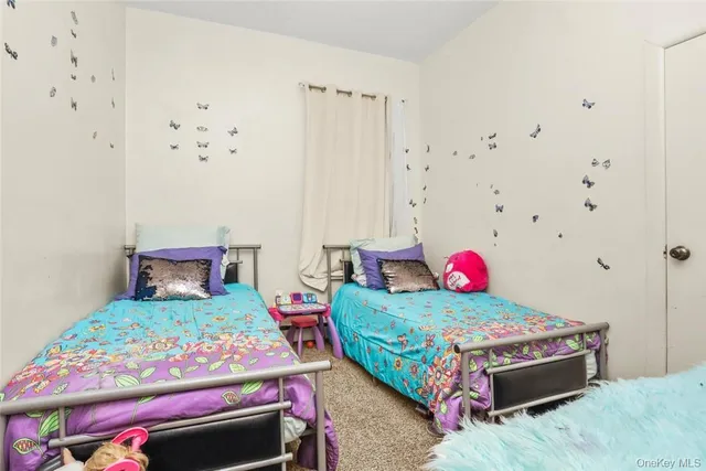 a bathroom with a glass door shower and a sink