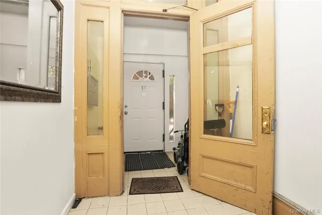 a view of room with window and wooden floor