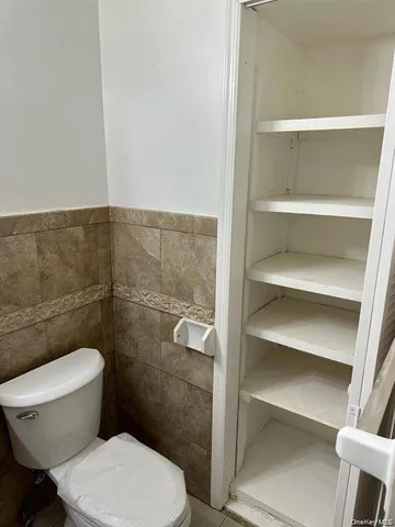 a view of a hallway with two white appliances