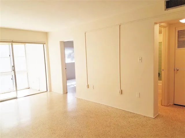 a view of an empty room with a window