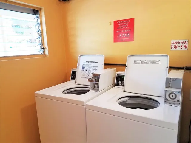 a view of a bathroom with a glass door and shower
