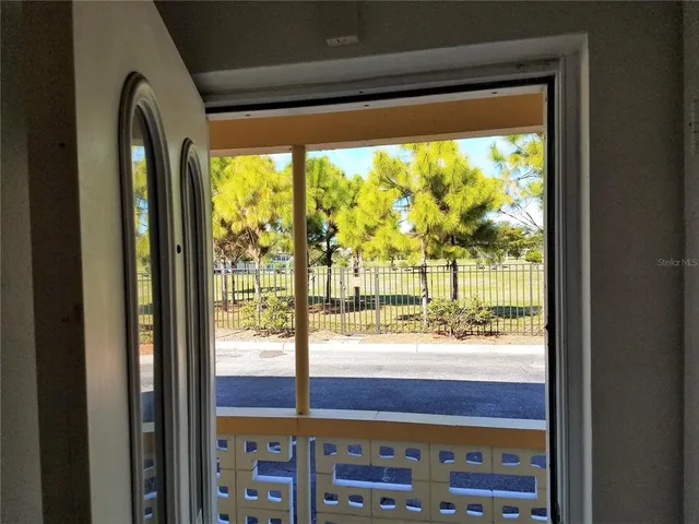 a view of a swimming pool with an outdoor space and seating area