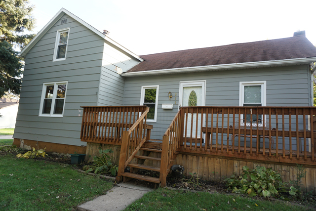 229 East 1st Street Spring Valley, IL 61362 - Photo 1 of 14 a front view of a house with garden