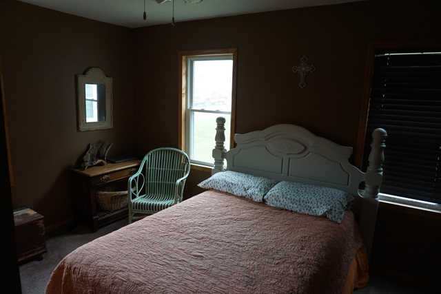 229 East 1st Street Spring Valley, IL 61362 - Photo 8 of 14 a bedroom with a bed and a mirror