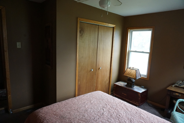 229 East 1st Street Spring Valley, IL 61362 - Photo 9 of 14 a bedroom with a bed and a dresser next to a window