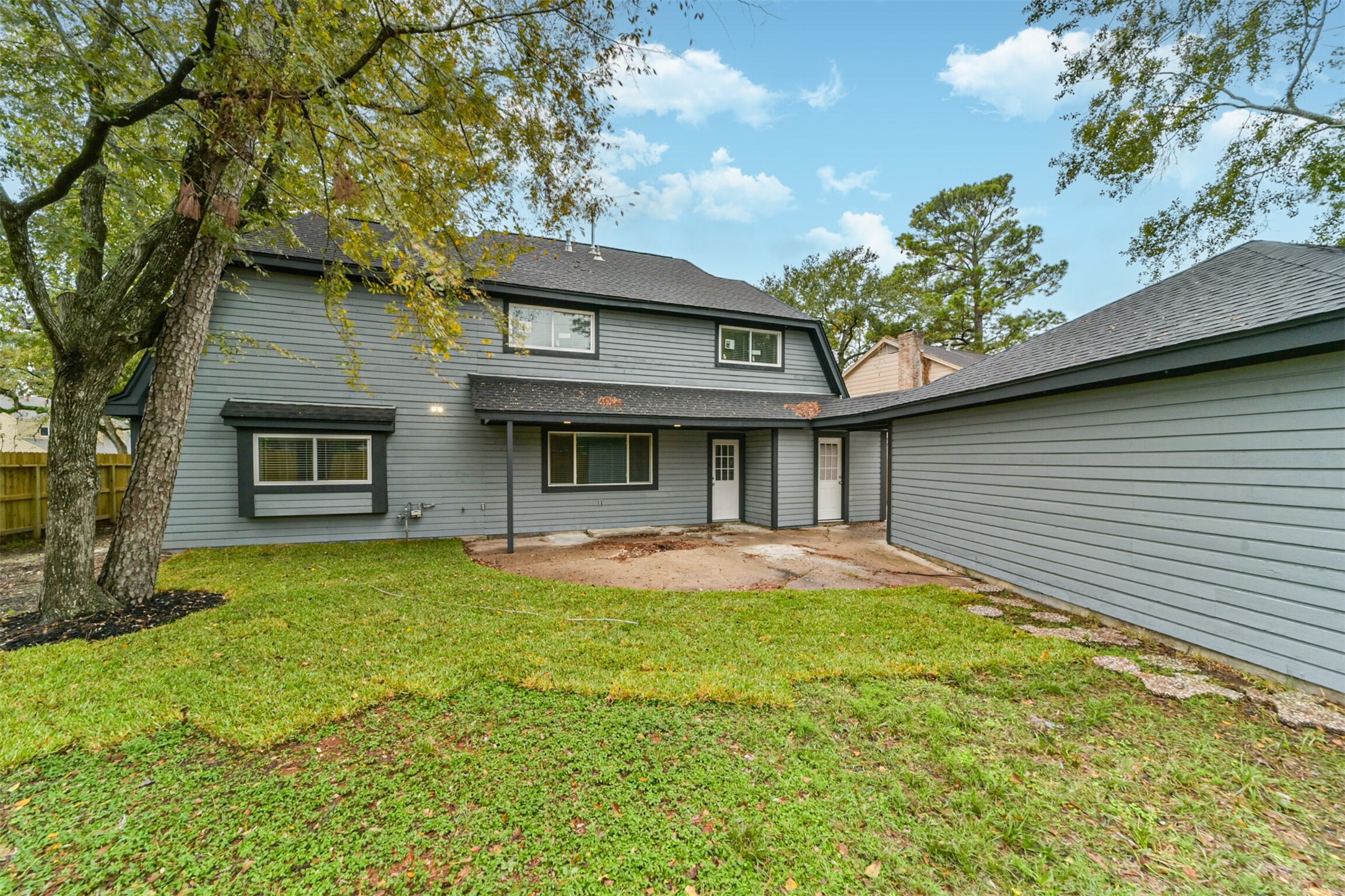 15610 Ripplewind Lane Houston, TX 77068 - Photo 41 of 44 a view of a house with a yard and large tree