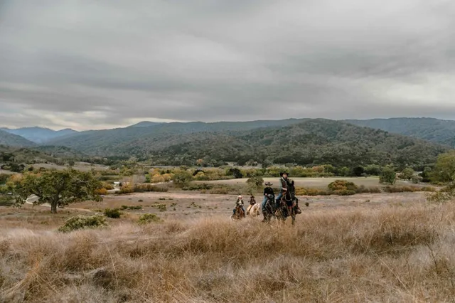 a view of a town with mountains in the background