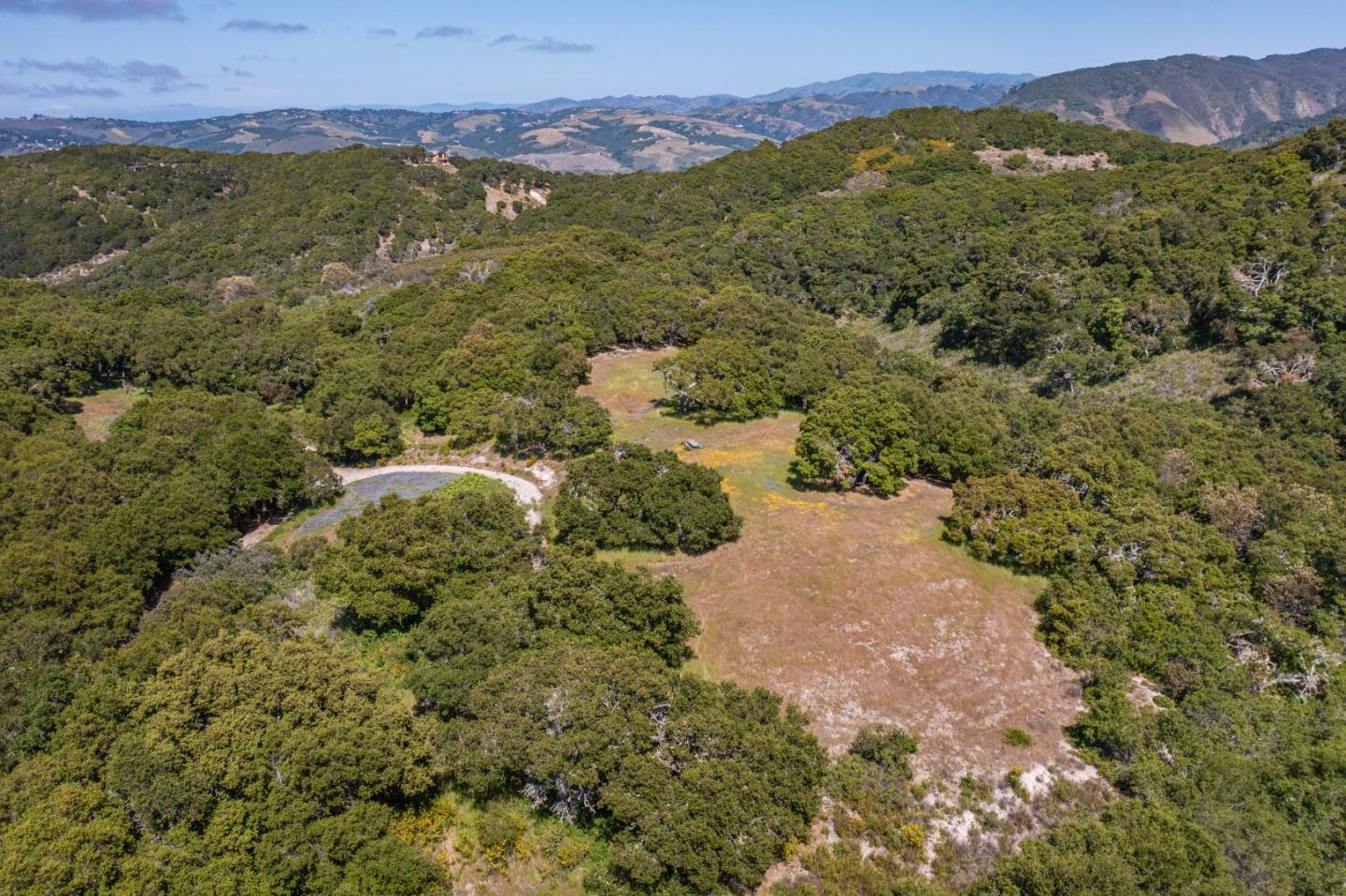 8 Corral Run Carmel, CA 93923 - Photo 5 of 22 a view of a lush green hillside and houses
