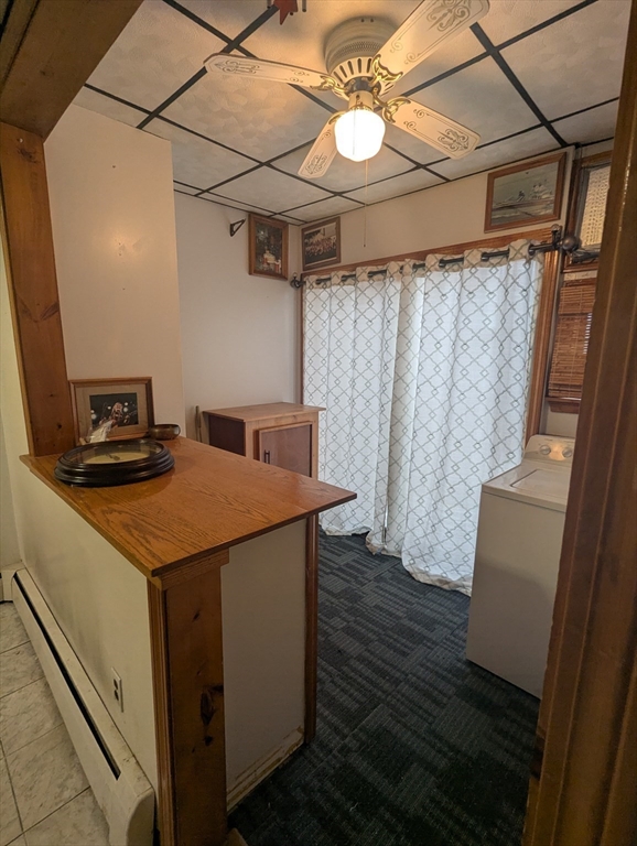205 London Street Boston, MA 02128 - Photo 5 of 13 a open kitchen with cabinets a sink and dishwasher a stove with wooden floor