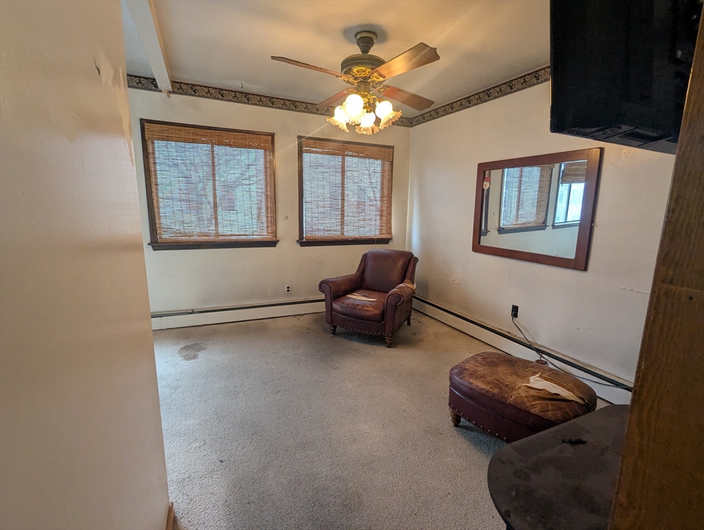 205 London Street Boston, MA 02128 - Photo 7 of 13 a living room with furniture and a window