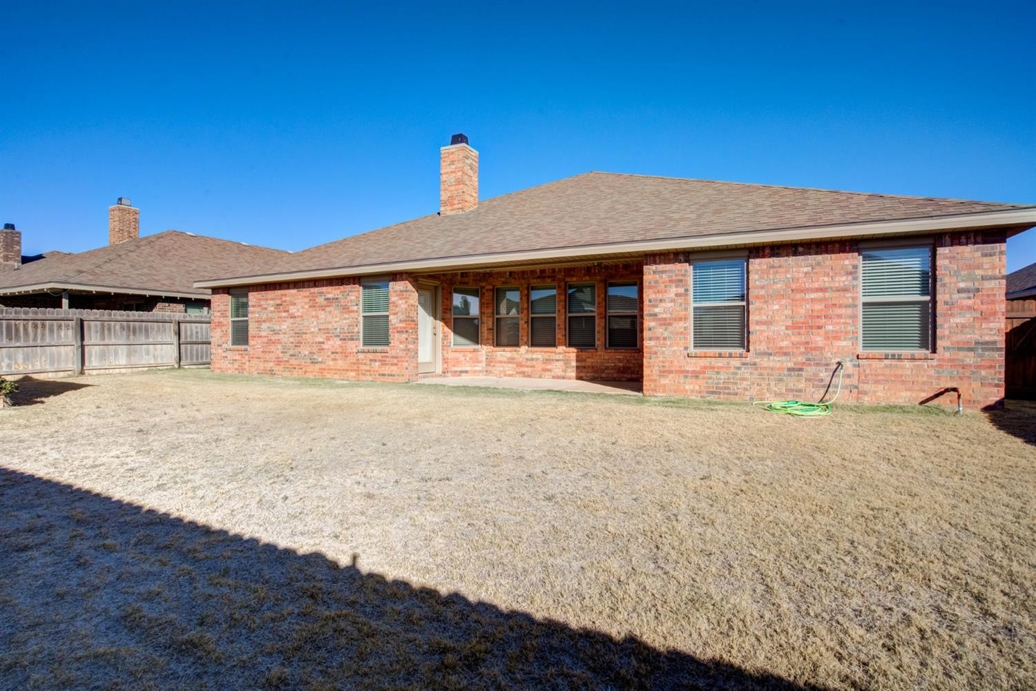 8806 Rochester Avenue Lubbock, TX 79424 - Photo 25 of 25 a front view of a house with a yard