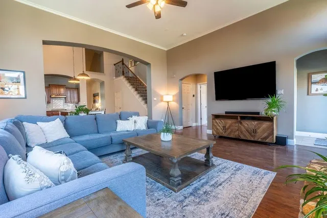 a living room with furniture and a flat screen tv