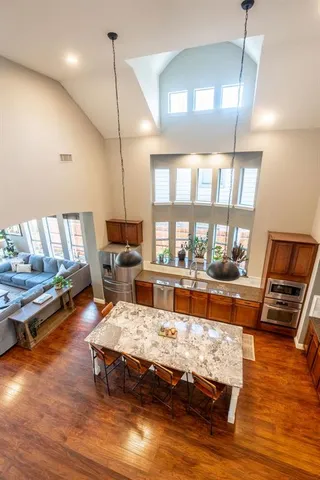 a view of a house with a yard and porch