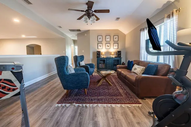 a spacious bedroom with a bed and a window