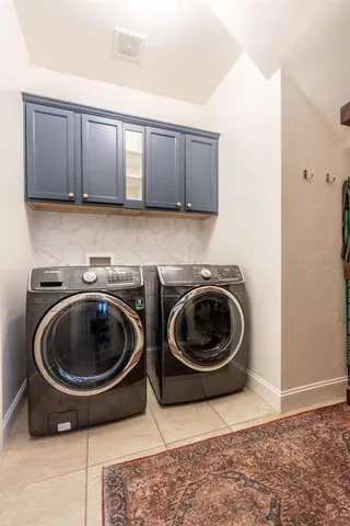a bathroom with 2 sink toilet and shower