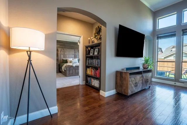 a living room with furniture and a flat screen tv