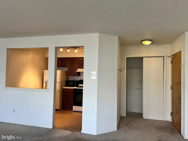 a view of a kitchen cabinets and a wooden floor