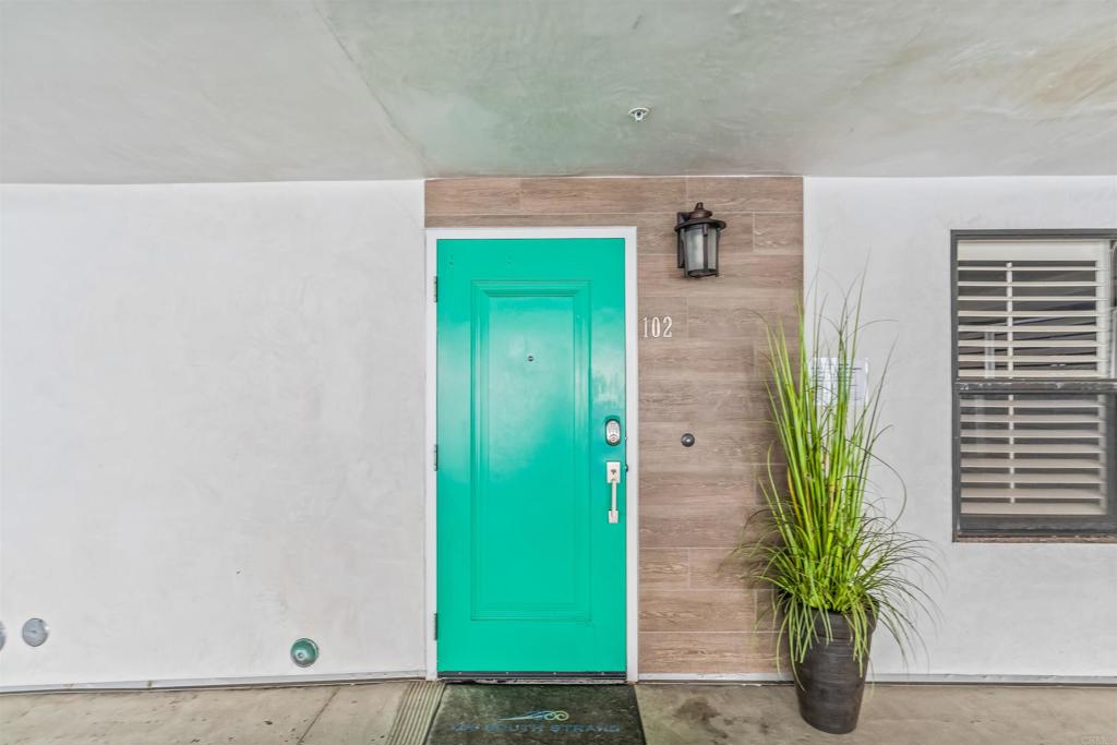 700 South The Strand, Unit 102 Oceanside, CA 92054 - Photo 24 of 25 a bathroom with a sink a potted plant and a shower