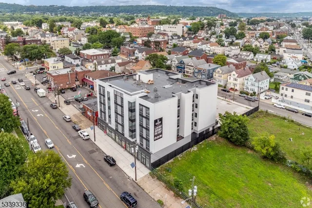 a view of a city with lawn chairs