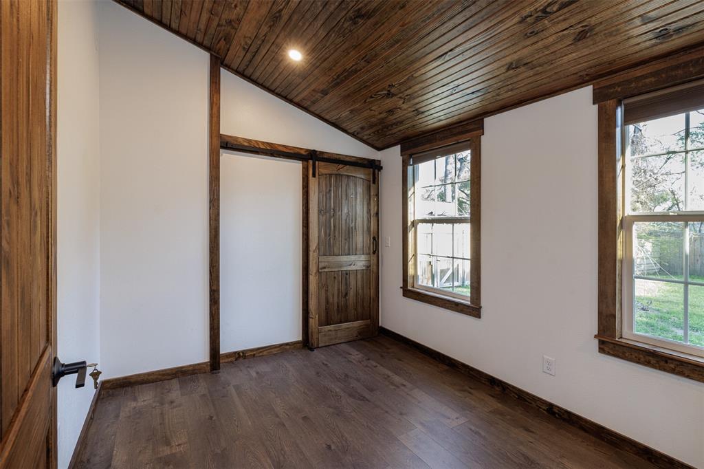 217 Houston Street Sulphur Springs, TX 75482 - Photo 22 of 35 an empty room with windows