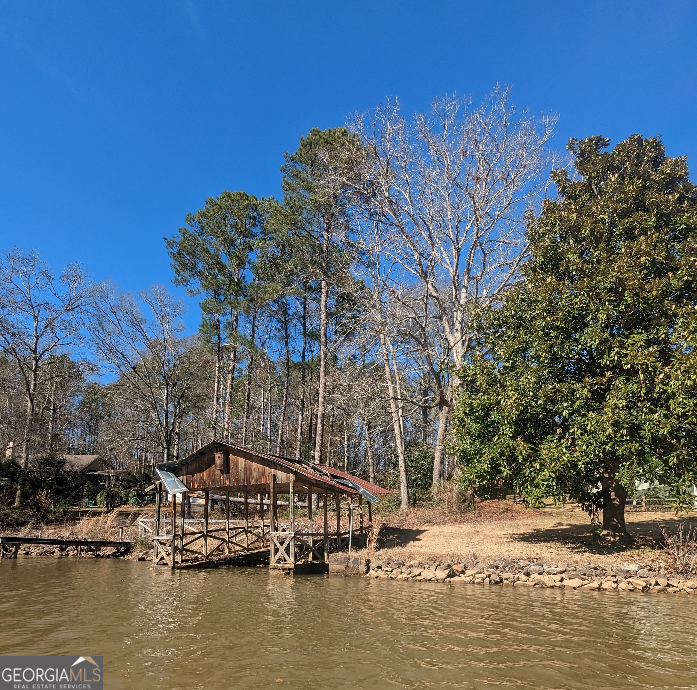 0 Collins Road Jackson, GA 30233 - Photo 7 of 7 a view of a lake with trees