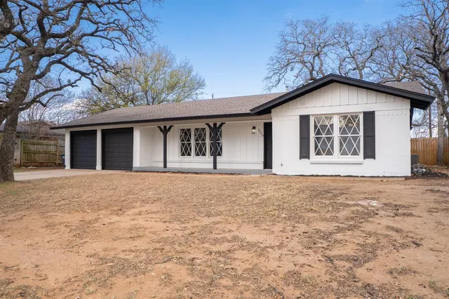 a house with trees in the background