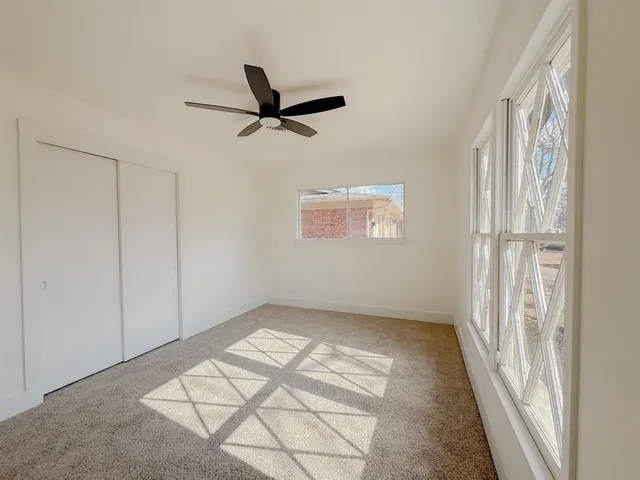 a view of an empty room and a window