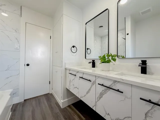 a bathroom with a sink and a mirror