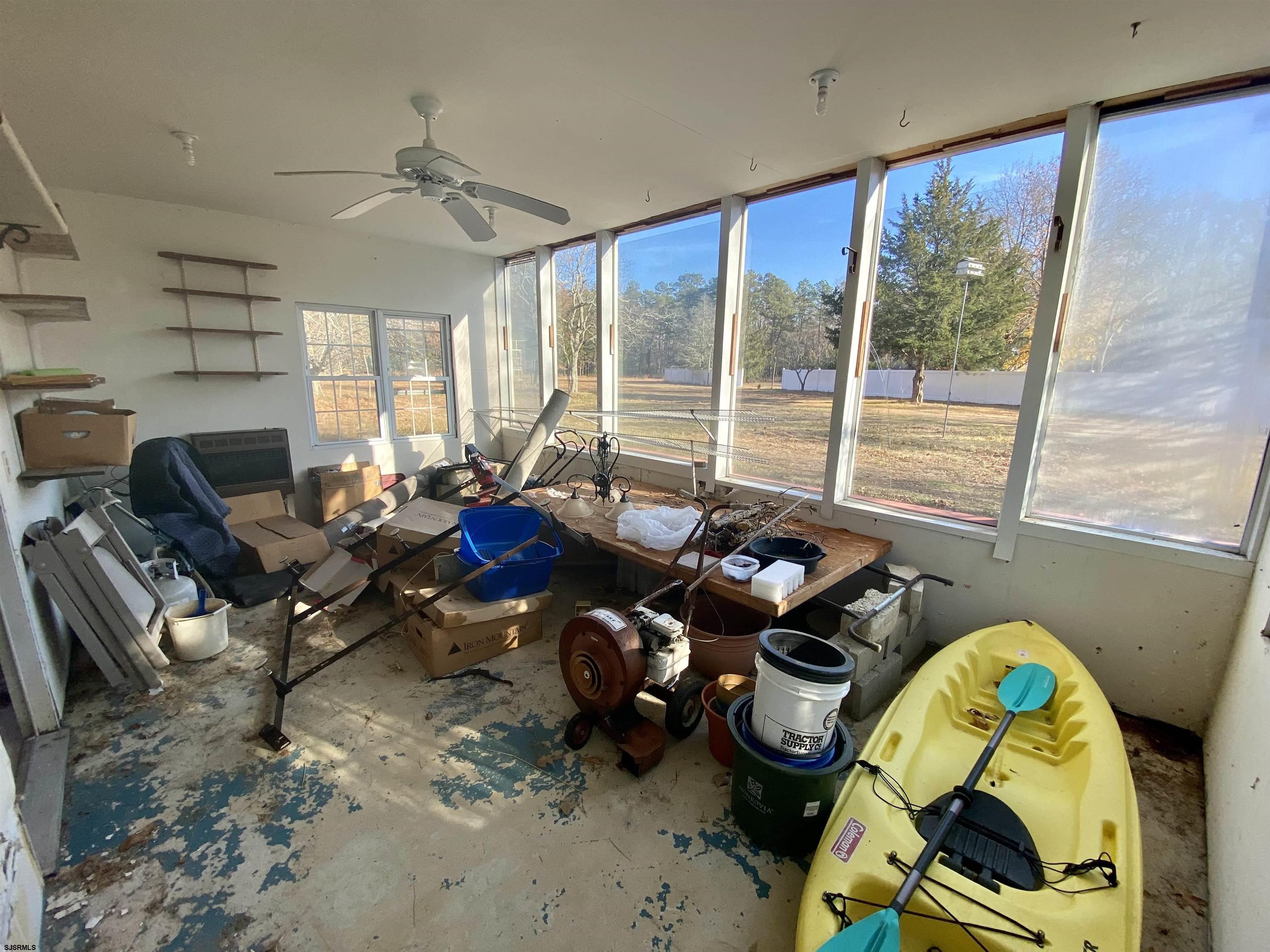 6705 Weymouth Road Mays Landing, NJ 08330 - Photo 11 of 38 a living room with furniture and floor to ceiling windows