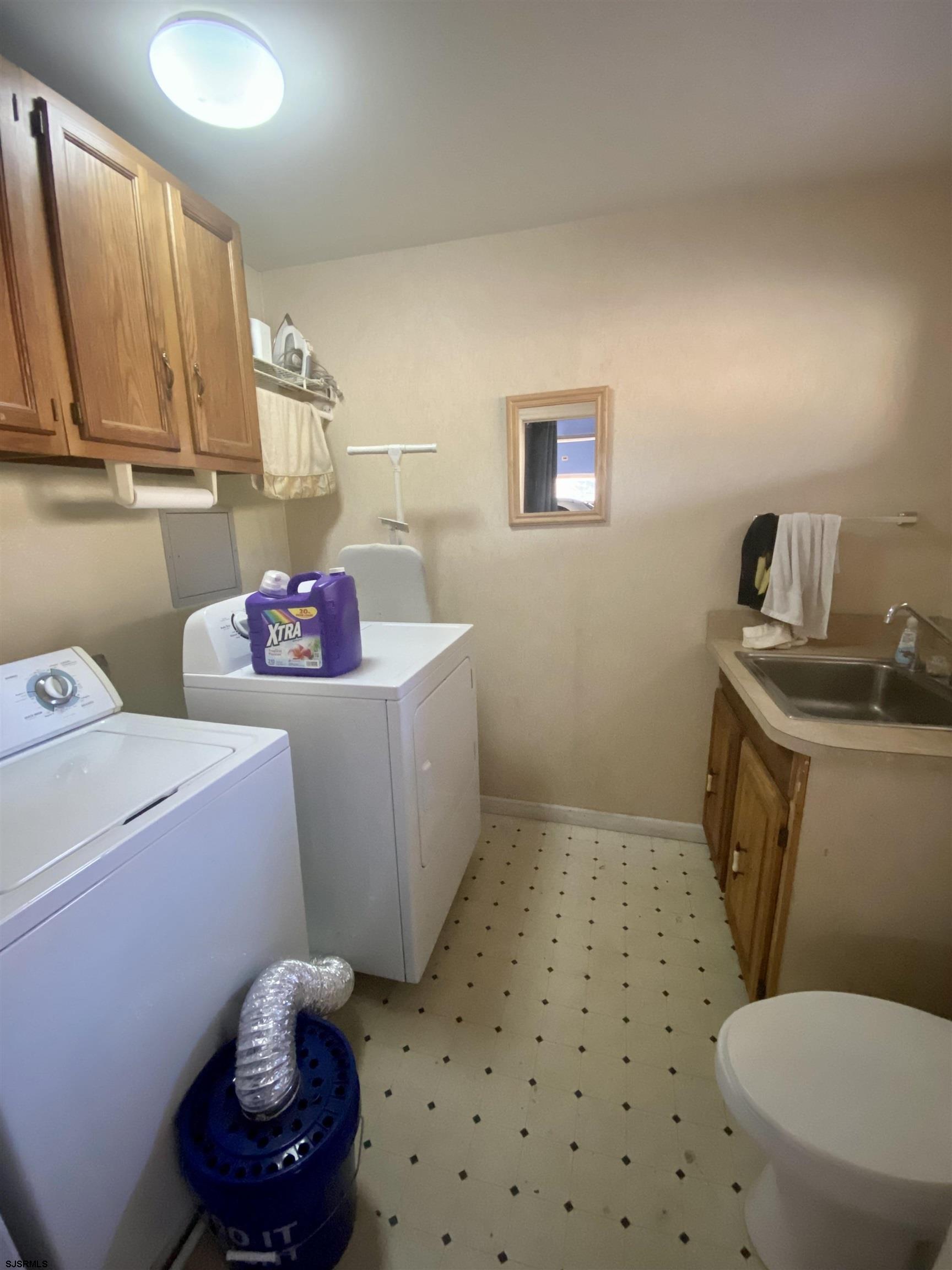 6705 Weymouth Road Mays Landing, NJ 08330 - Photo 13 of 38 a bathroom with a sink a toilet and a shower