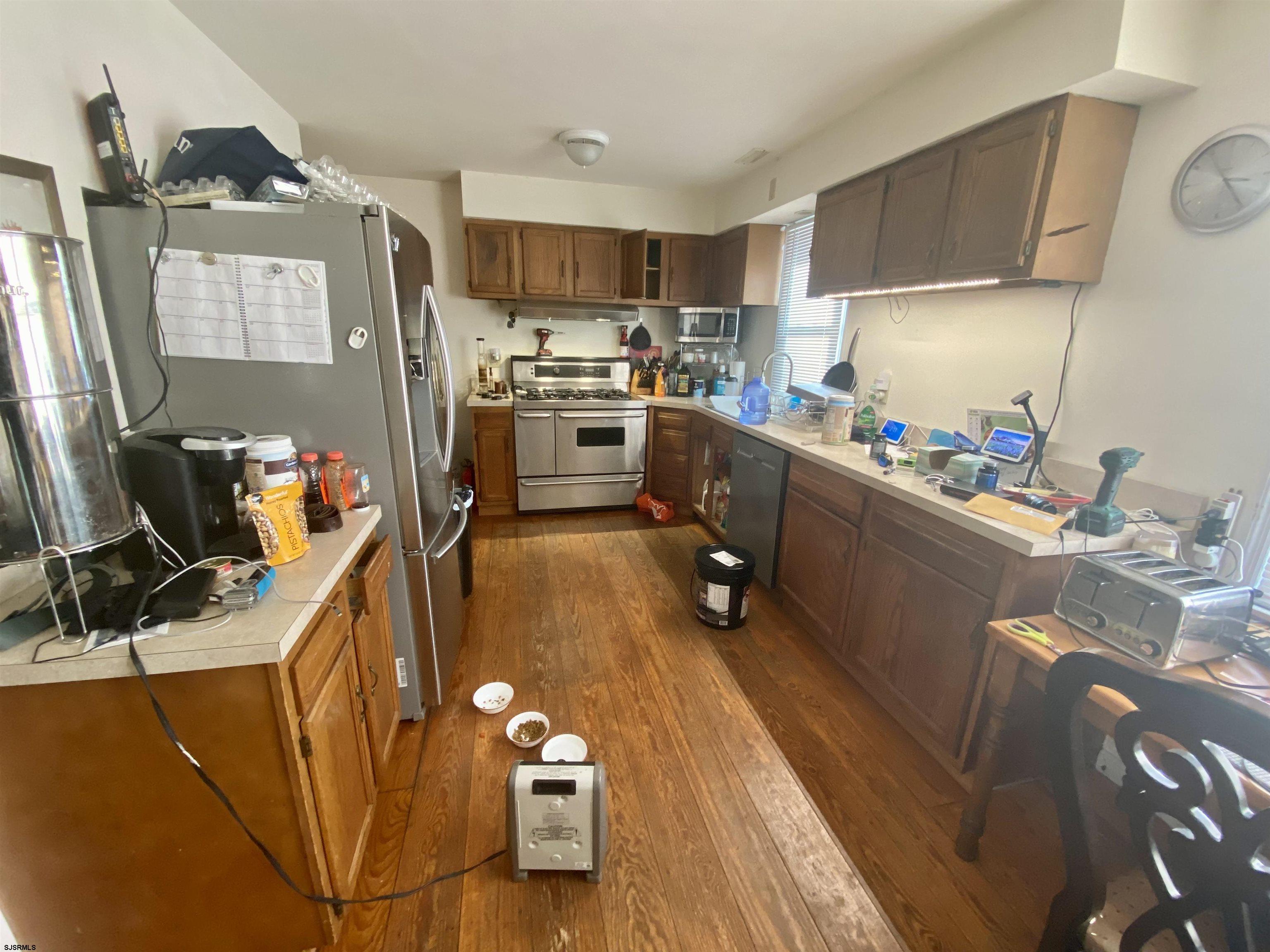 6705 Weymouth Road Mays Landing, NJ 08330 - Photo 18 of 38 a kitchen with a sink appliances and cabinets